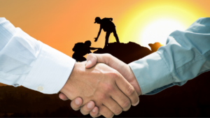 Shake hands and climber in the back who help each other